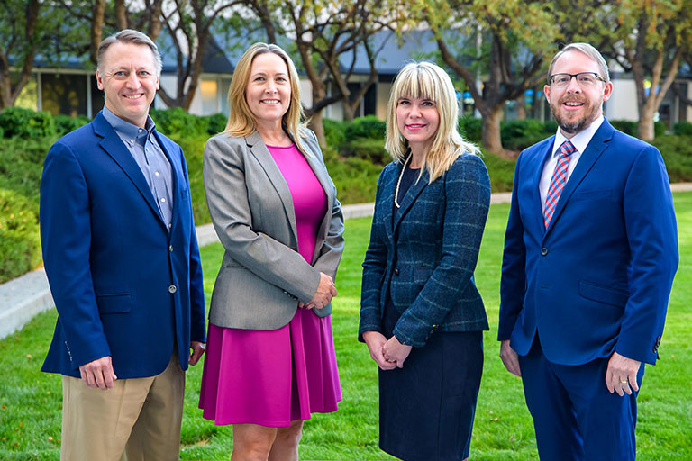 Photograph of four members of the Hawley Troxell Staff