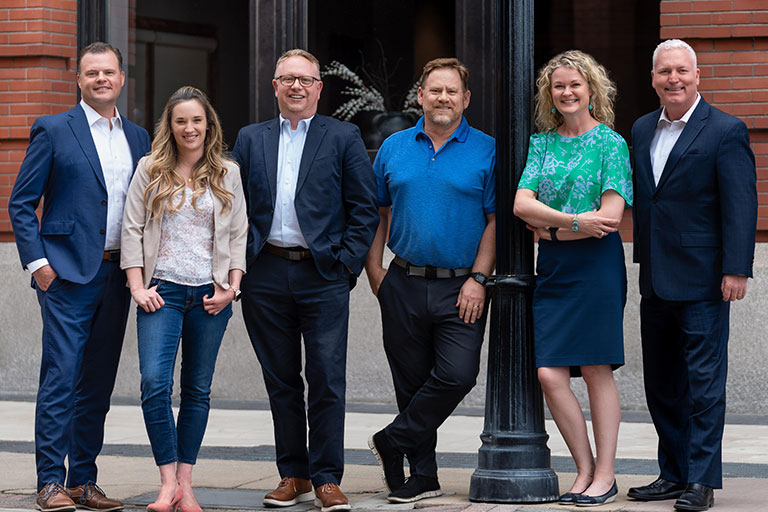 Photograph of six of the Hawley Troxell staff in downtown Spokane, Washington
